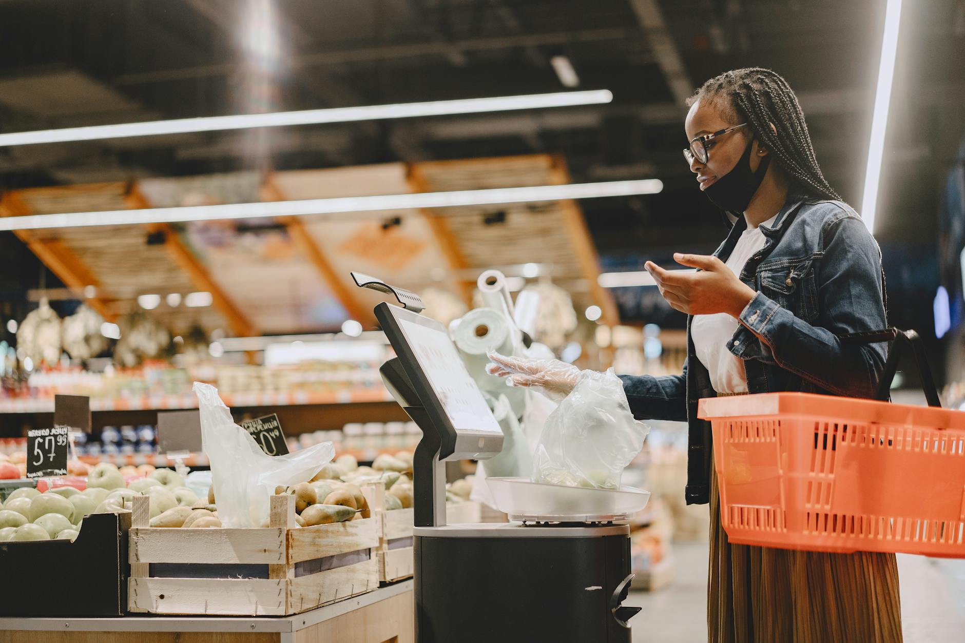 Hypermarket checkout bagging a weekly grocery haul
