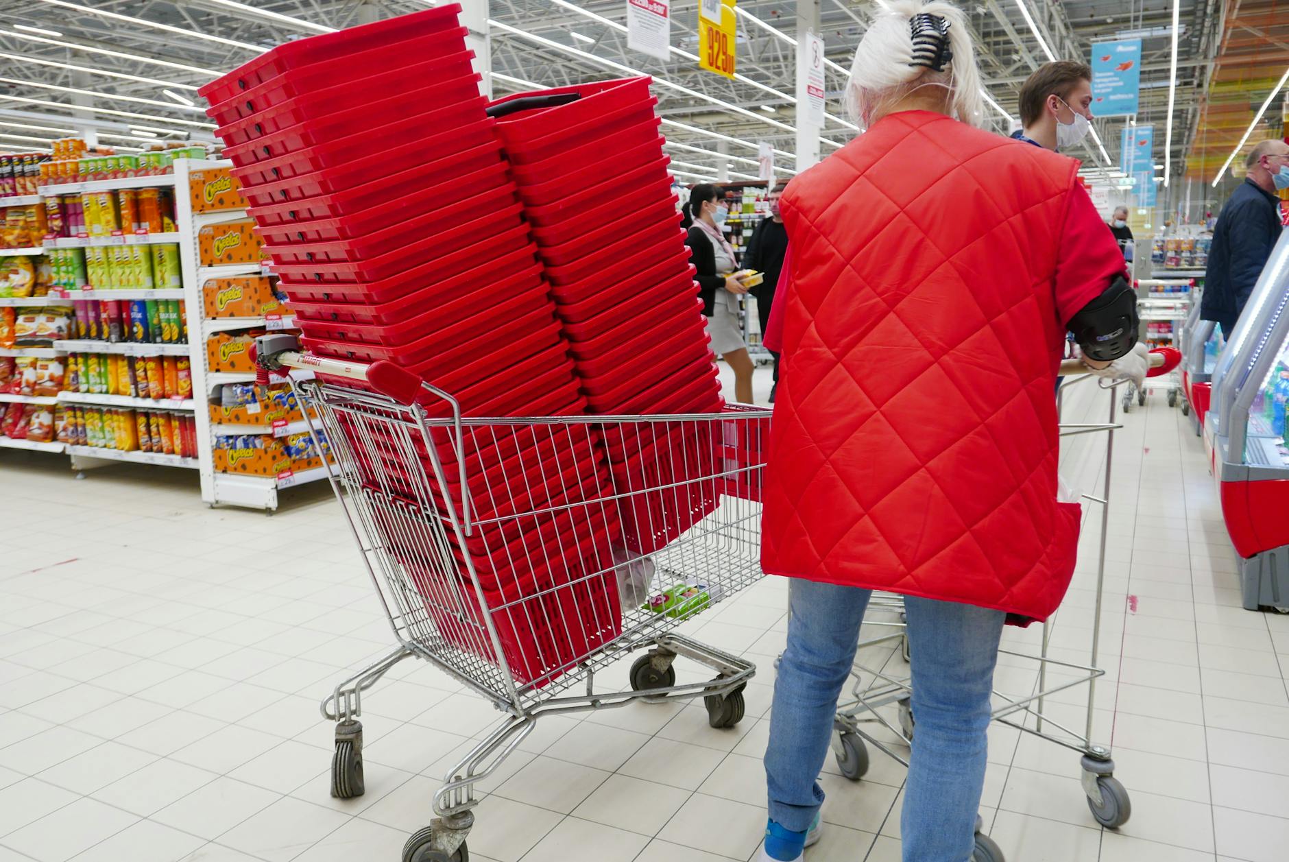 Trolley in a hypermarket aisle on a weekly shop