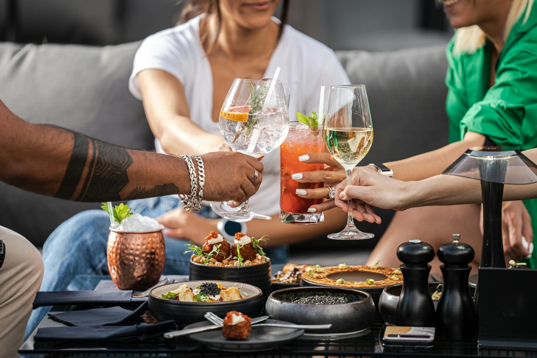 Friends at a weekend brunch table at a Dubai cafe