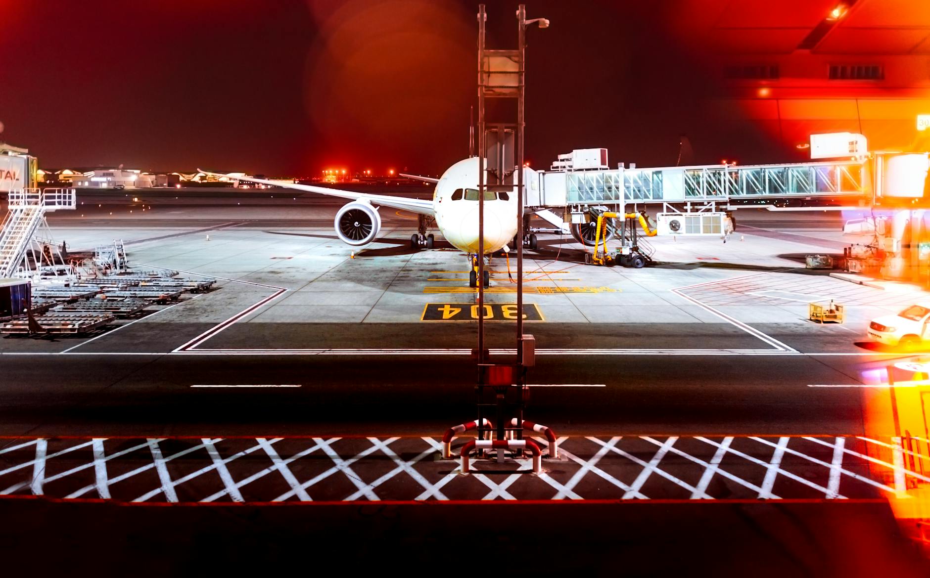 Wide-body aircraft at an airport gate at night