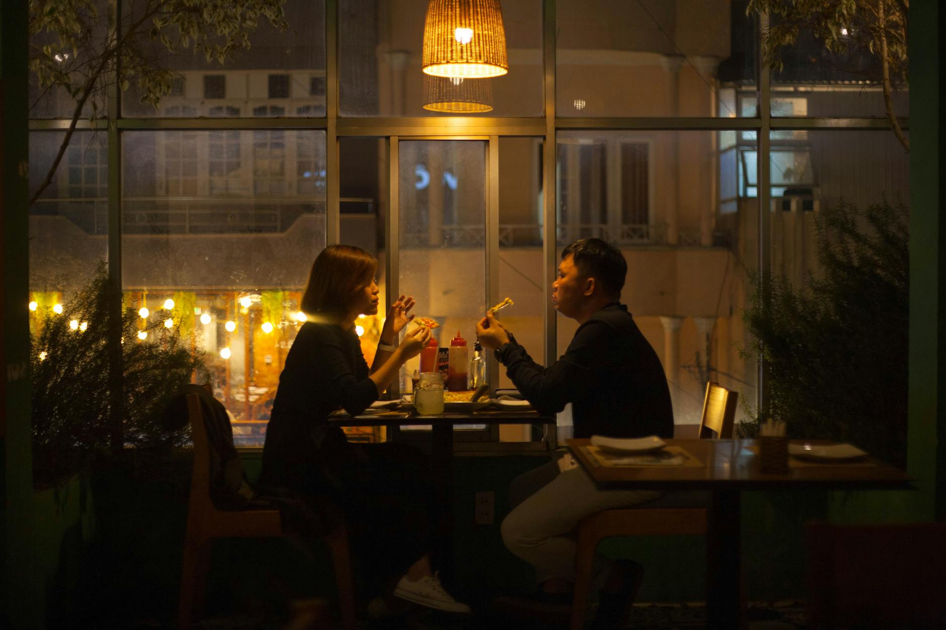Couple dining at a modern restaurant in the evening