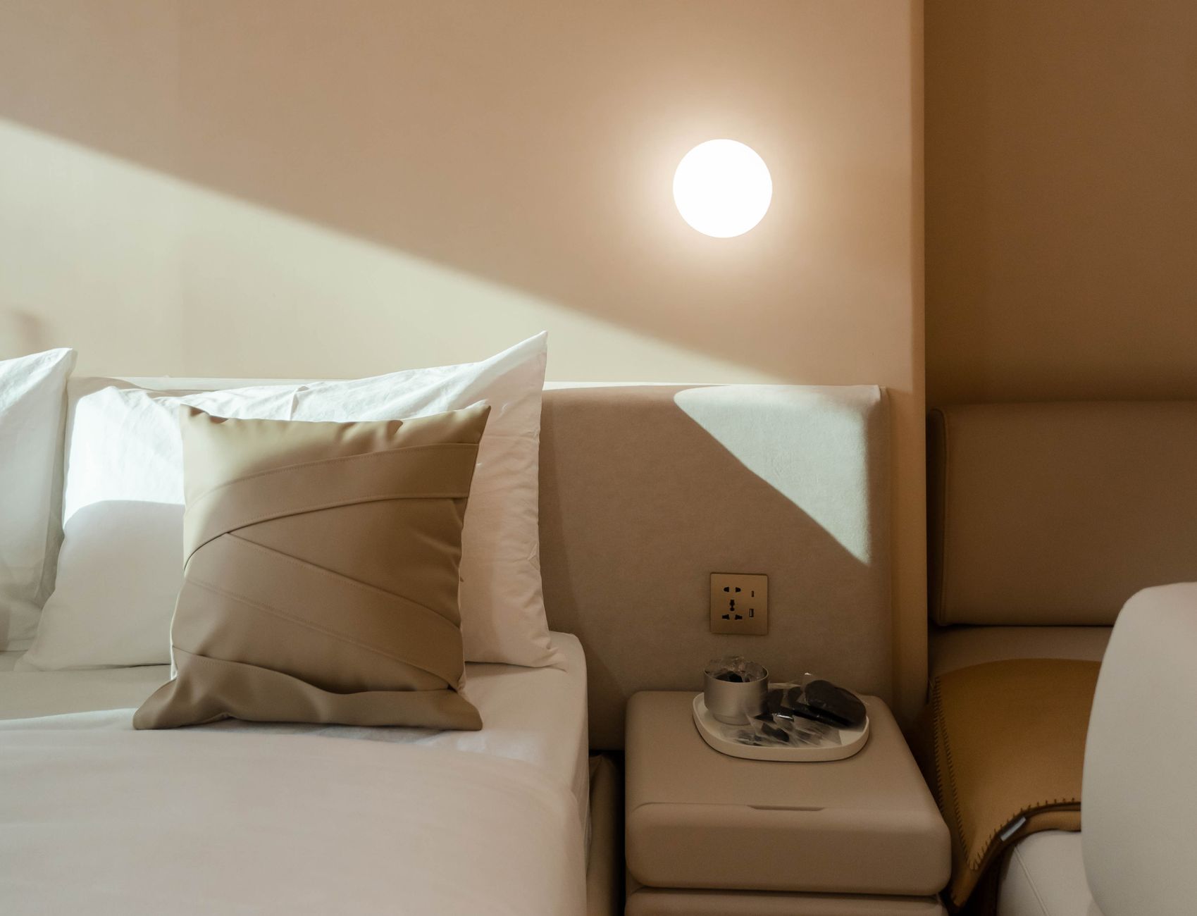 An upscale hotel room in neutral tones