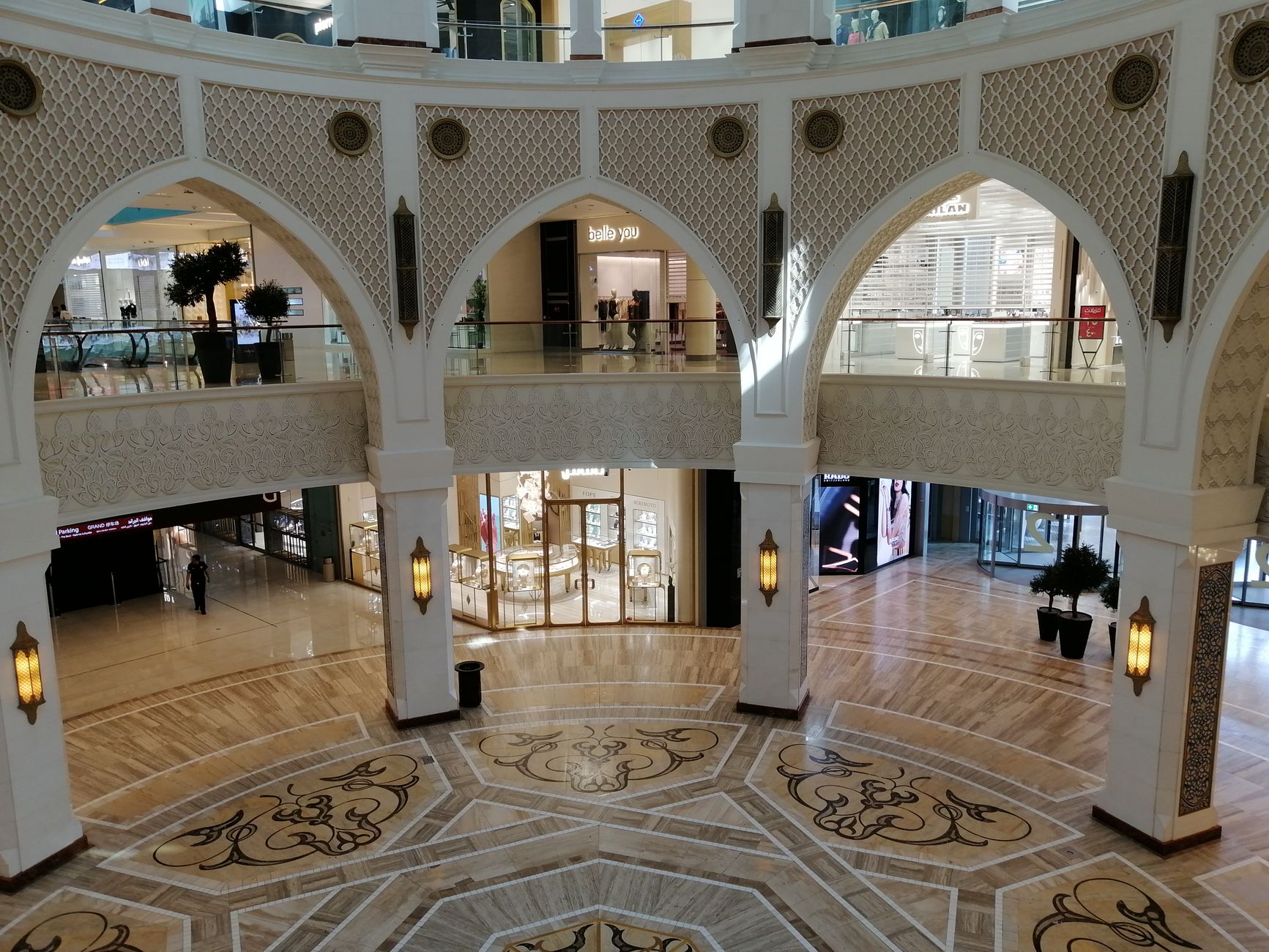 Shoppers in a bright Dubai mall interior